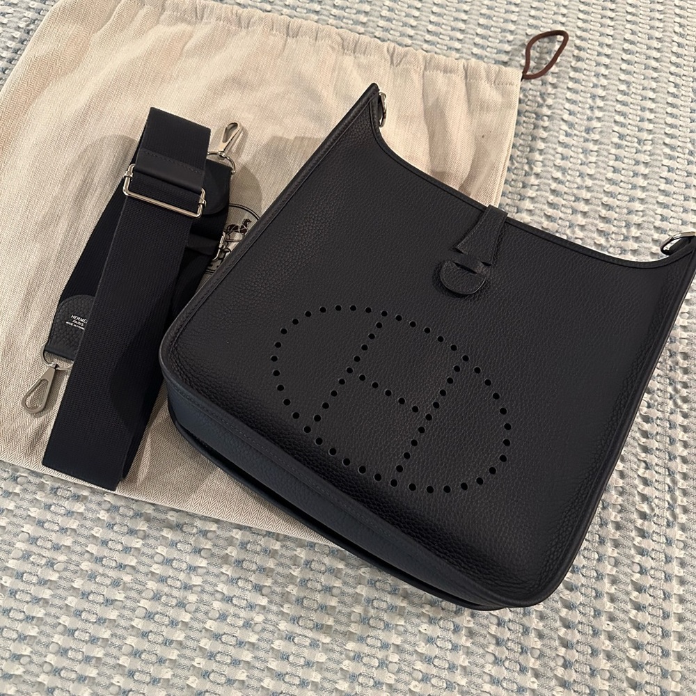 Hermés Evelyne 29 Blue Nuit with matching strap with silver hardware. RARE!